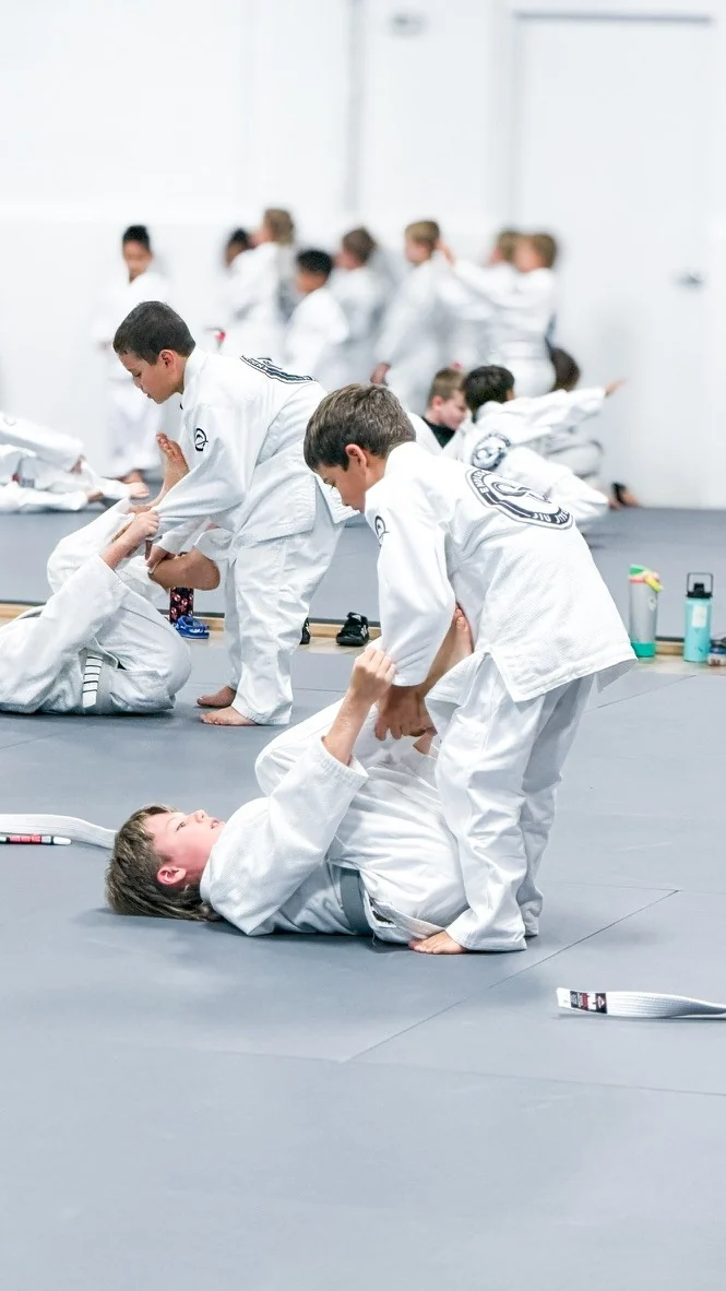Jiu Jitsu practice with the academy identity on the gis